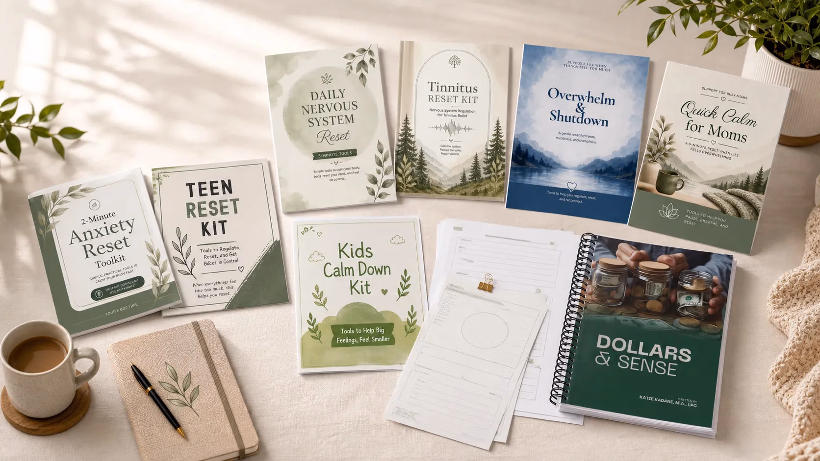 Therapy-informed workbooks and printable nervous system support resources spread across a desk with a journal, pen, and coffee